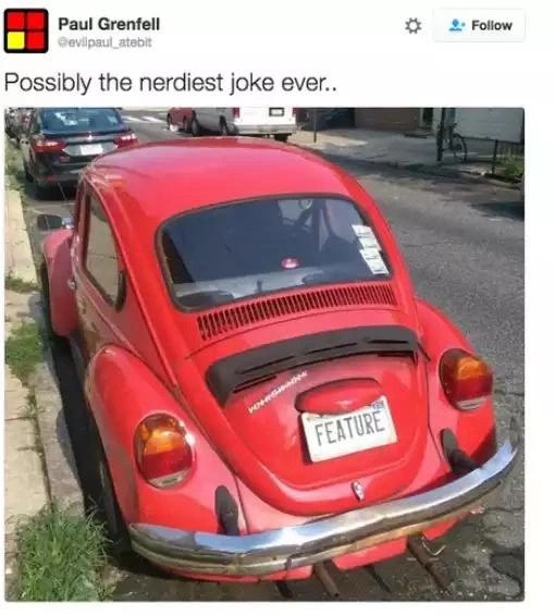Volkswagen “Bug” with FEATURE plate - classic dev punch-line in the wild